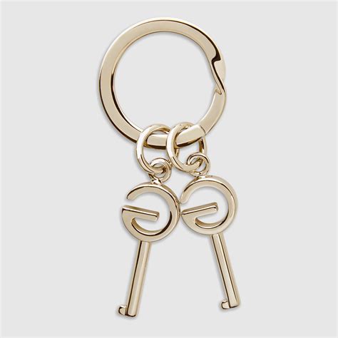 gucci gold and brown heart keychain|Gucci keychain.